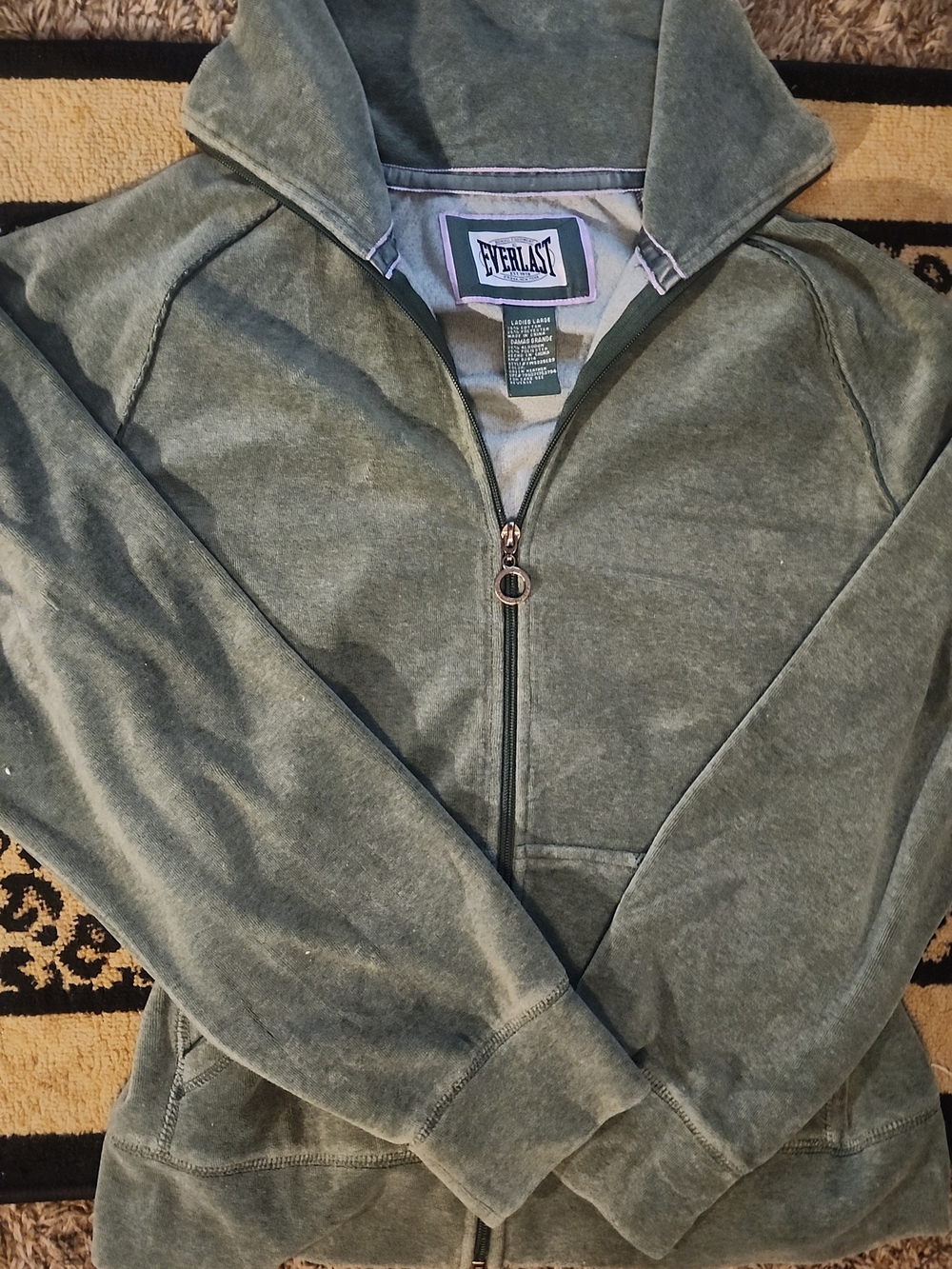 Vintage Everlast Women's Green Velour Track Jacket with a full zip closure.